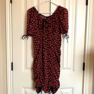 Pink flowered dress, form fitting. Ties on bottom